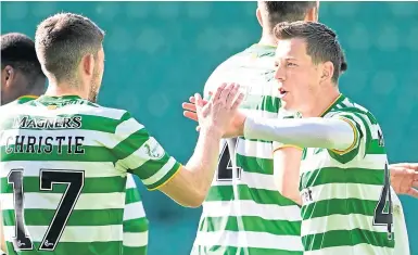  ??  ?? Ryan Christie celebrates his goal with Callum McGregor