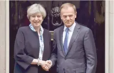  ?? Reuters ?? Theresa May greets Donald Tusk outside 10 Downing Street in central London on Thursday.—