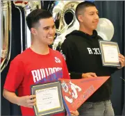  ?? RECORDER PHOTO BY MATTHEW SARR ?? Future Fresno State Bulldogs Desi Armendarez (left) and Armando Salazar were among 71 Monache High School seniors recognized for their commitment to attending four-year universiti­es next year at the College Signing Day event Tuesday in the MHS cafeteria.