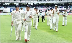  ?? Photograph: Gallo Images/ Getty Images ?? The England team leave the field after winning the third Test.