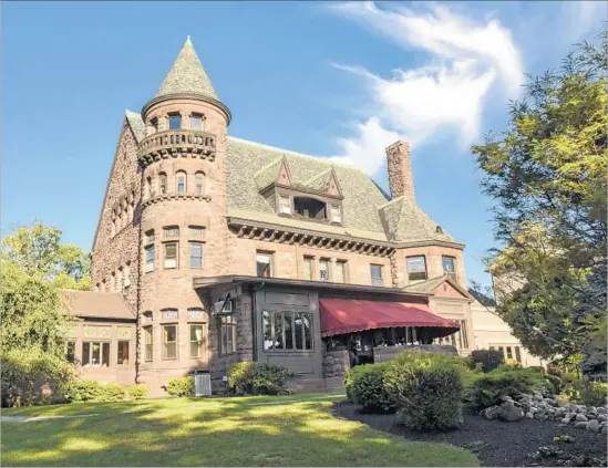  ?? Photograph­s by Margo Pfeiff ?? DREAM of staying in a castle? You can at Belhurst, a grand, turreted Victorian mansion in Geneva, N.Y., where the estate’s red wine f lows to overnight guests.