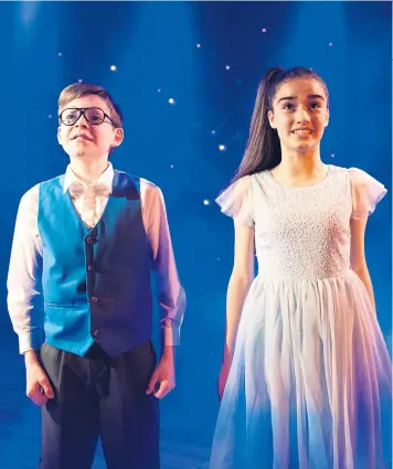  ??  ?? A show for all ages: Benjamin Lewis as Adrian Mole, and Asha Banks as Pandora, the object of his desire An infectious joy: Benjamin Lewis as Adrian and Asha Banks as Pandora