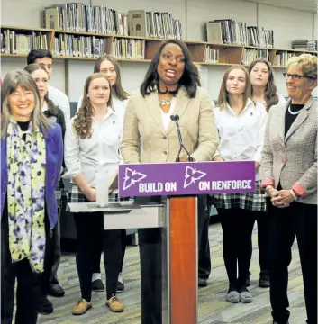  ??  ?? Ontario Education Minister Mitzie Hunter, centre, says offering online testing is the best way to support students.