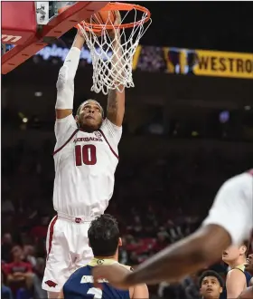  ?? Craven Whitlow/Special to the News-Times ?? Slammed: Arkansas' Daniel Gafford, a former standout at El Dorado, goes up for a jam during the Razorbacks' contest against UC Davis earlier this week in Fayettevil­le. The Razorbacks will host Indiana on Sunday.