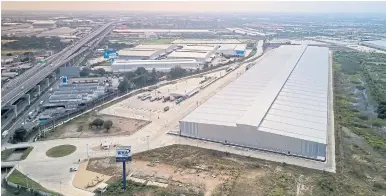  ?? RIGHT ?? An aerial view of Lazada’s newest and largest warehouse in the Eastern Economic Corridor.