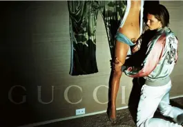  ??  ?? 2003 Gucci ad Roitfeld had a model sport an intimate version of the house’s G logo