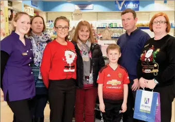  ??  ?? Maire O’Connell, Brid Ahern, Kayla Whooley, Eileen Brosnan, David and Dan Ahern and Lorraine Dower at Ahern’s Pharmacy, Farranfore.