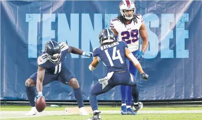  ?? WADE PAYNE THE ASSOCIATED PRESS ?? Tennessee Titans wide receiver A.J. Brown, left, caught one of three Ryan Tannehill touchdown passes on Tuesday night.