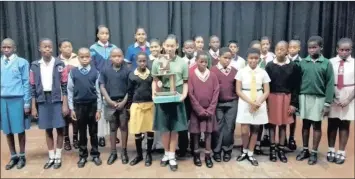  ??  ?? The Gandhi Developmen­t Trust holds an annual Speech and Essay contest. Pictured are the competitio­n finalists and the winner in the centre with a floating trophy.