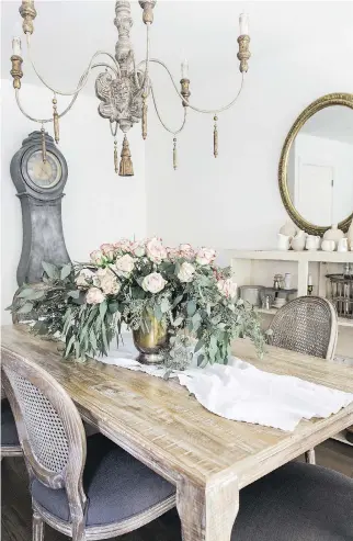  ?? SO MUCH BETTER WITH AGE ?? A dining room designed by Jamie Lundstrom. “The French just know how to do any style well, whether it’s fashion or home décor. I love their architectu­re and ornate detailing,” says Lundstrom, shown on facing page, author of French Vintage Décor: Easy and Elegant DIY Projects for Any Home.