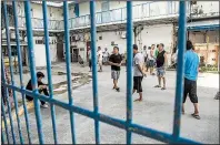  ?? AP/DANIEL LIN ?? In this July photo, Chinese laborers at the Imperial Pacific Casino gather in front of their living quarters before a protest in Saipan, the Northern Mariana Islands, a U.S. commonweal­th in the Western Pacific.