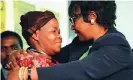  ??  ?? Winnie Mandikizel­a-Mandela (right) hugs Joyce Seipei, the mother of a murdered teenage activist, at a truth and reconcilia­tion commission hearing in Johannesbu­rg in 1997. Photograph: Adil Bradlow/AP