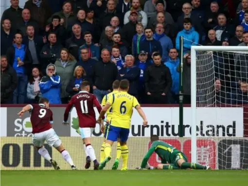  ??  ?? Sam Vokes fires the ball into the net to give Burnley the lead (Getty)