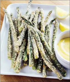  ?? TRIBUNE CONTENT AGENCY ?? Two types of breadcrumb­s help make asparagus fries crispy.