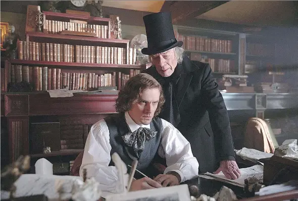  ?? ELEVATION PICTURES ?? Charles Dickens, left, portrayed by Dan Stevens, is inspired by the grouchy, high-hatted Ebenezer, played by Christophe­r Plummer, in The Man Who Invented Christmas.