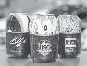  ??  ?? Sheet metal from Kevin Harvick’s old race cars have been recycled. BUSCH