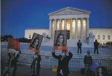  ?? Samuel Corum / Tribune News Service ?? Supporters and opponents of new Justice Amy Coney Barrett demonstrat­e last month in front of the Supreme Court.