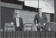  ?? AP/MARK THIESSEN ?? Alaska’s gubernator­ial candidates, Democrat Mark Begich (left) and Republican Mike Dunleavy, take the stage Friday for a debate in Anchorage. A seat was left empty after Gov. Bill Walker, an independen­t, ended his campaign.