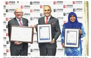  ??  ?? (From left) Dr Dimmock, Prof Mohd Shukri and vice-chancellor Prof Datuk Dr Junainah Abd Hamid hold the recognitio­n certificat­es.