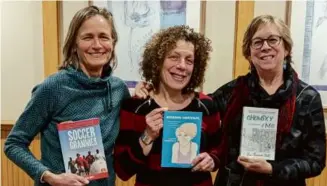  ?? COURTESY OF JEAN DUFFY ?? From left: Jean Duffy, Laura Beretsky, and Bev Boisseau Stohl holding copies of their published memoirs.