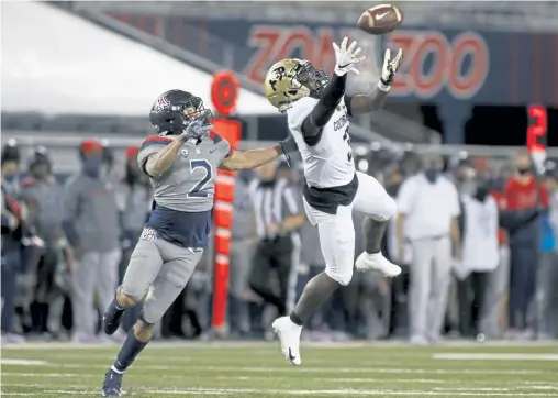  ?? Ralph Freso, Getty Images ?? Wide receiver K. D. Nixon ( 3) and the Colorado Buffaloes are undefeated in Pac- 12 play this fall, but could find themselves locked out of the conference championsh­ip game even if they win this Friday night against Utah.