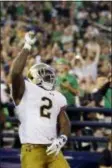  ?? GREGORY BULL — ASSOCIATED PRESS ?? Notre Dame’s Dexter Williams celebrates after scoring against Navy Saturday in San Diego. The Irish won, 44-22