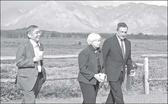  ?? REUTERS ?? (From left) Governor of the Bank of Japan Haruhiko Kuroda, US Federal Reserve chair Janet Yellen and president of the European Central Bank Mario Draghi walk after posing for a photo opportunit­y during the annual central bank research conference in...