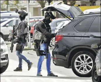  ?? REUTERS/AP ?? (Above) Police are seen after a shooting in Utrecht, Netherland­s, on Monday. (Left) Gokmen Tanis, the suspect.