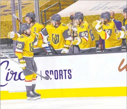  ?? Chase Stevens Las Vegas Review-journal @csstevensp­hoto ?? Knights center Chandler Stephenson celebrates his second goal against the Kings with teammates during the third period.