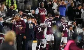  ?? Photograph: Simon Dael/REX/ Shuttersto­ck ?? The West Ham forward Michail Antonio celebrates with a cardboard cut-out of himself after making it 3-1, the first of his two goals against Leicester.