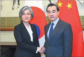  ?? WANG JING / CHINA DAILY ?? Foreign Minister Wang Yi meets Kang Kyung-wha, his Republic of Korea counterpar­t, at the Diaoyutai State Guesthouse in Beijing on Wednesday.