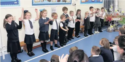  ??  ?? Culture P1- 3 pupils use sign language 131017Fish­erton_ 2