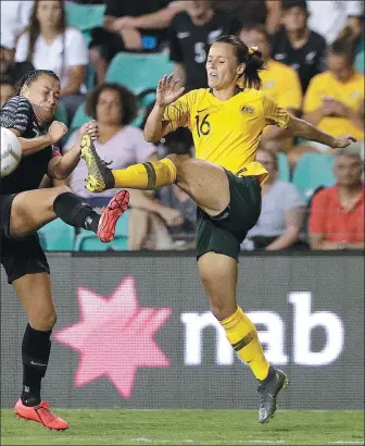  ?? RICK RYCROFT / AP ?? Australia's Hayley Raso (right) clears the ball past New Zealand's Ali Riley during last week’s Cup of Nations clash in Sydney.