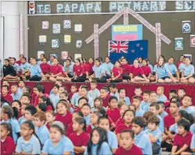  ??  ?? Surprise time, left: A school assembly is held where ANZ representa­tives tell students about the new gear.