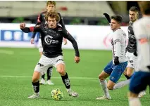  ?? GETTY/AP ?? Joe Bell, left, takes charge against Colombia at the Under-20 World Cup. Bell, top, in action for Norway’s Viking FK and, below, after scoring for Virginia.