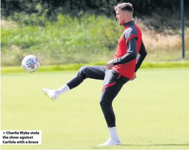  ??  ?? Charlie Wyke stole the show against Carlisle with a brace