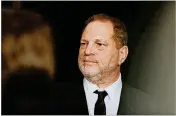 ?? EMILY BERL/THE NEW YORK TIMES ?? Hollywood producer Harvey Weinstein is shown at a Golden Globes afterparty in Los Angeles Jan. 10, 2016. Weinstein was fired from the company he founded with his brother following reports that he paid at least eight settlement­s to women who complained...
