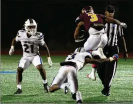  ?? JAMIE SPAAR FOR THE ATLANTA JOURNAL-CONSTITUTI­ON ?? Tucker’s Jordan McCoy avoids a tackle Friday night in his team’s 40-14 win over Chamblee.