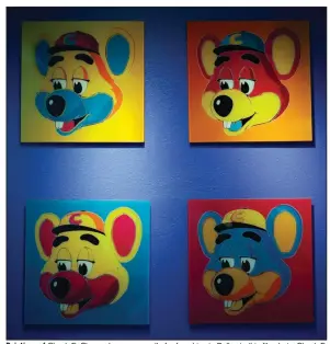  ?? (The Dallas Morning News/G.J. McCarthy) ?? Paintings of Chuck E. Cheese hang on a wall of a franchise in Dallas in this file photo. Chuck E. Cheese pizzeria has filed for bankruptcy protection.