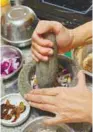  ?? BUZZ TEAM ?? Aromatics being prepared using a pestle and mortar. –