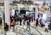  ?? GABRIELA BHASKAR — BLOOMBERG, FILE ?? Shoppers walk through Macy’s flagship store in the Herald Square area of New York in 2020.