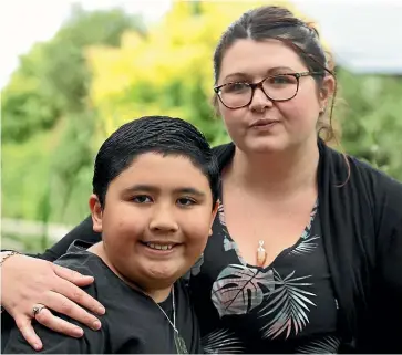  ?? LUKE KIRKEBY/STUFF ?? Tirau mother Natalie Barnett and her nine-year-old autistic son Arapeta who she has been forced to home school due to no schools wanting to take him in.