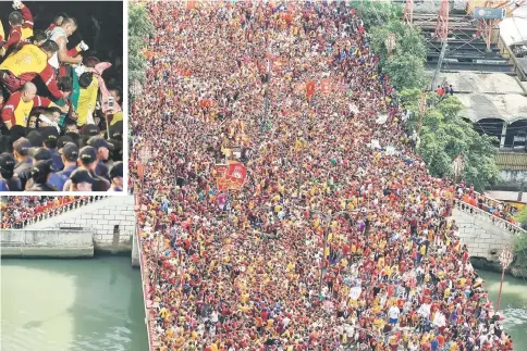  ??  ?? Devotees occupy Jones bridge as they take part in the annual procession of the Black Nazarene in metro Manila, Philippine­s. — Reuters photo
