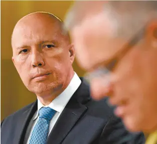  ??  ?? Minister for Home Affairs Peter Dutton and Prime Minister Scott Morrison.