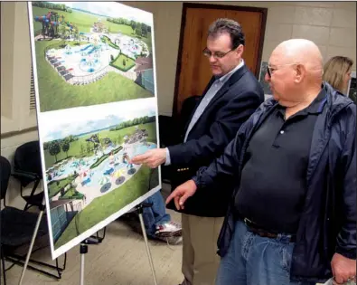  ?? Arkansas Democrat-Gazette/DAVE HUGHES ?? Andrew Smith (left) with Larkin Aquatics of Kansas City, Mo., describes features of the planned aquatics center at Ben Geren Park in Fort Smith to Otis Edwards of Greenwood. Edwards was one of about 50 people who attended public meetings held Monday...