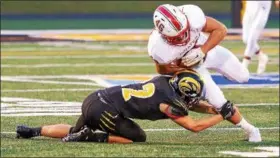  ?? CARRIE GARLAND — THE NEWS-HERALD ?? Perry’s Cameron Rogers carries against Riverside on Aug. 24.