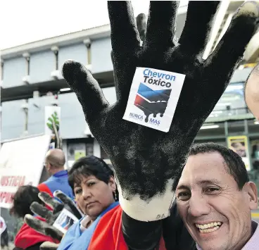  ?? RODRIGO BUENDIA / AFP / GETTY IMAGES FILES ?? Ecology groups in Ecuador protest on Internatio­nal anti- Chevron Day in 2014