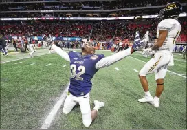  ?? PHOTOS CONTRIBUTE­D BY JASON GETZ ?? North Carolina A&T defensive back Marquis Willis exults at the end of the 21-14 victory in the Celebratio­n Bowl at Mercedes-Benz Stadium.