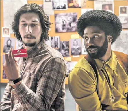  ?? David Lee Focus Features ?? DIRECTED by Spike Lee, “BlacKkKlan­sman,” with Adam Driver, left, and John David Washington, was given its world premiere.