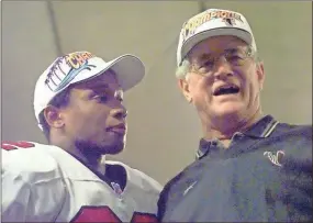  ?? Richard marshall ?? Atlanta Falcons’ head coach Dan Reeves, (right), celebrates his team’s victory with running back Jamal Anderson following Sunday’s NFC Championsh­ip game against the Minnesota Vikings at the Hubert H. Humphrey Metrodome in Minneapoli­s. The Falcons beat the Vikings 30-27 in overtime.
